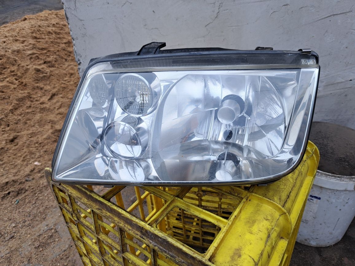 Lampa lewa przód vw bora