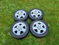 Komplet kół Opel 5x110 + felgi stalowe + opony zimowe + kołpaki