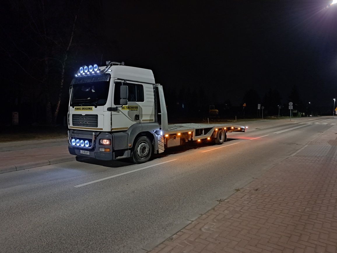 Pomoc drogowa kock transport maszyn usługi transportowe laweta