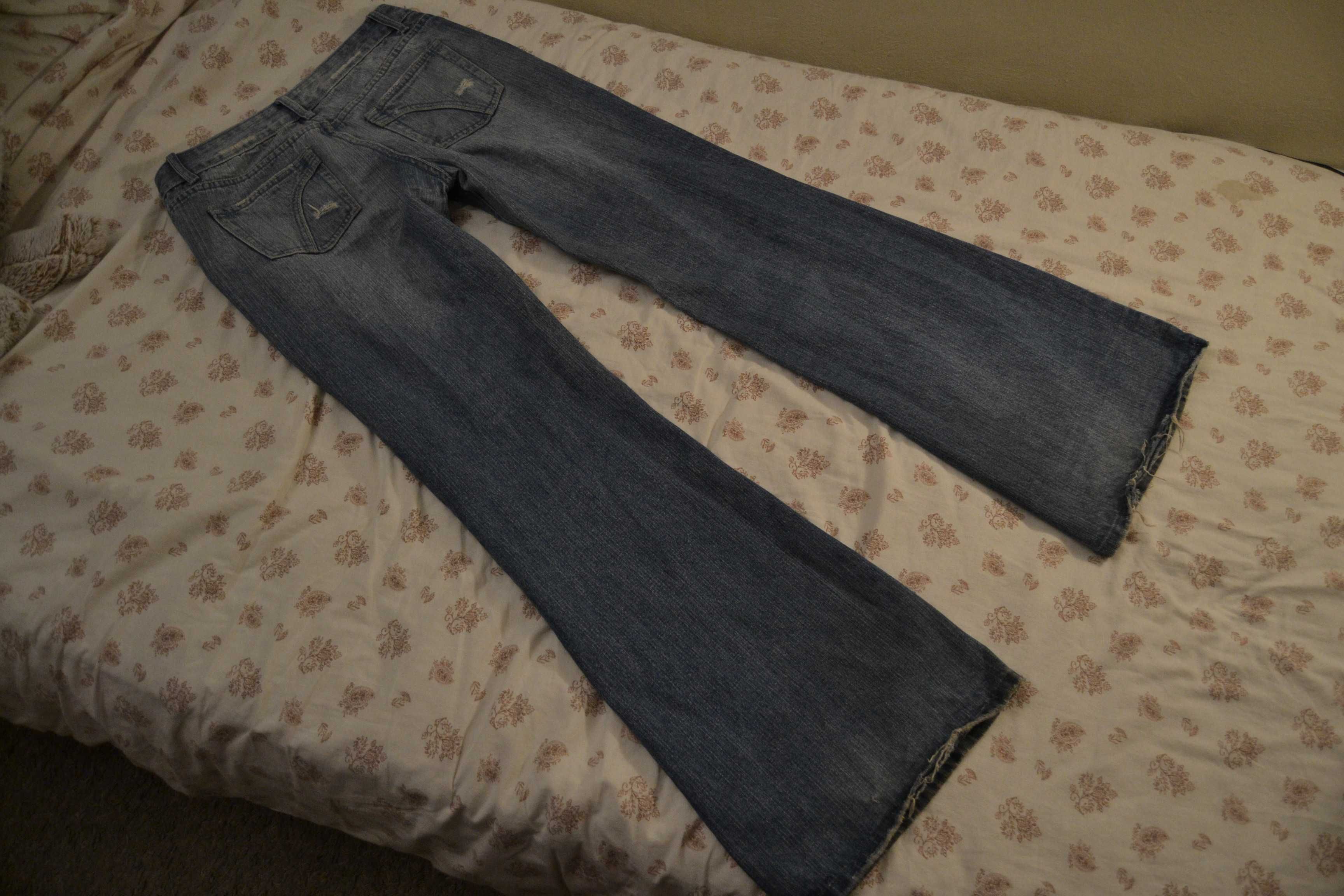 Jeansy dzwony z ozdobnymi łatami 40 L jasne vintage size 31