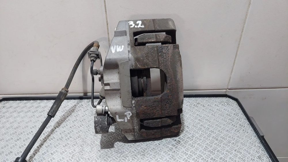 ZACISK HAMULCOWY LEWY PRZÓD VW PASSAT B6 R2009 3,2B