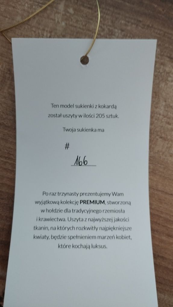 Długa elegancka sukienka z kokardą Taranko