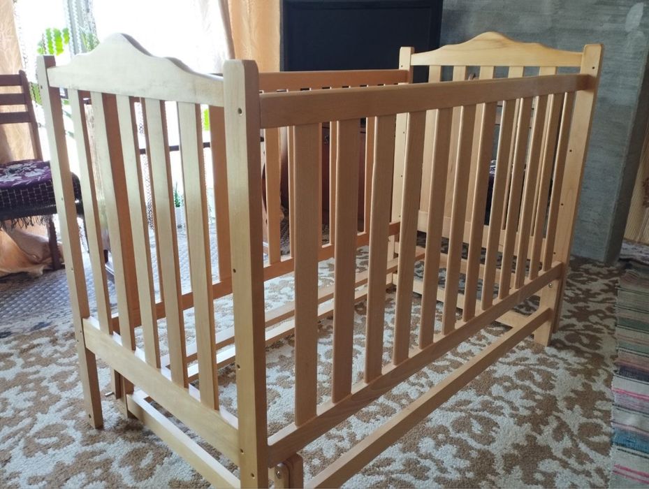 Ліжечко з маятником для дитини від народження до 4 років