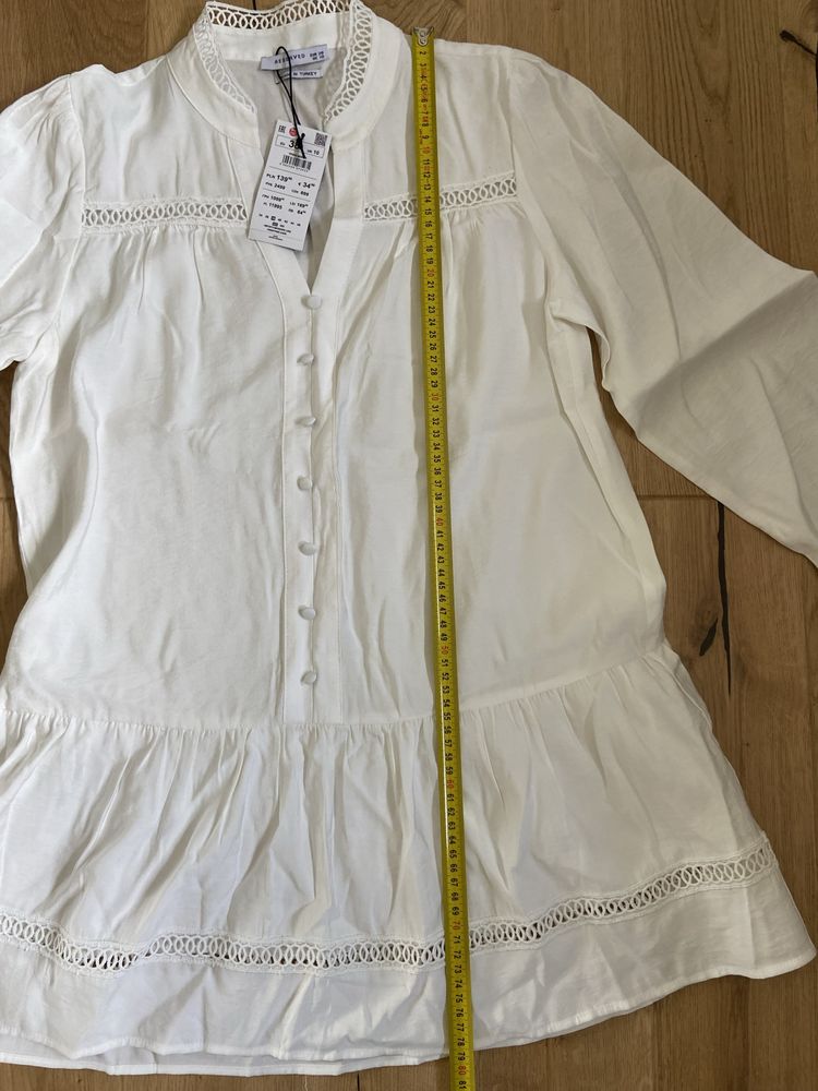 Elegancka biala smietankowa koszula o przedluzonym fasonie Reserved 38