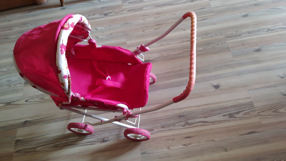 Іграшкова коляска для ляльок