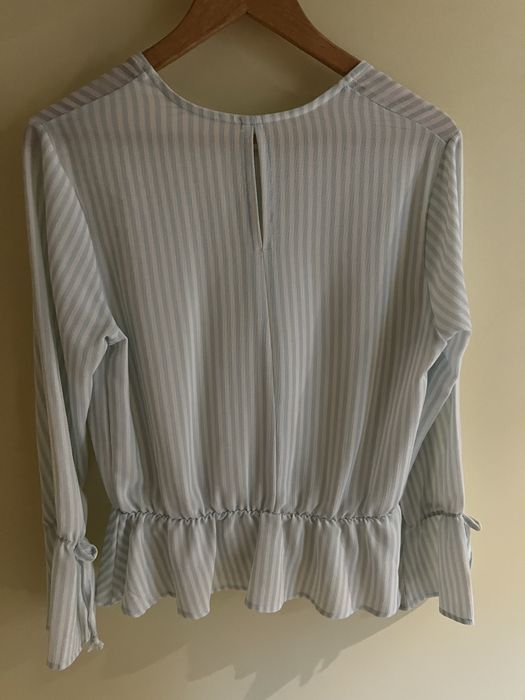 Blusa com folho de manga comprida