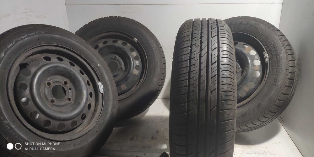 Koła 4x100 165/70R14 NISSAN komplet stalowe felgi opony LASSA FULDA