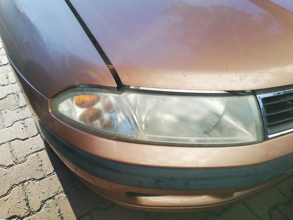 Lampa przód Mitsubishi Carisma lift