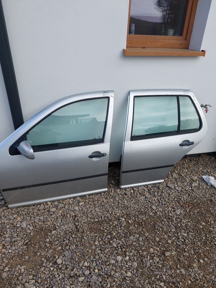 Drzwi lewe golf IV 4 2002r srebrne LA7W