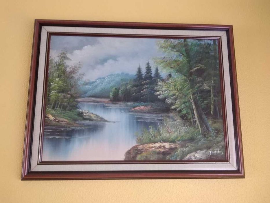 Quadros com paisagens em caixilho de madeira