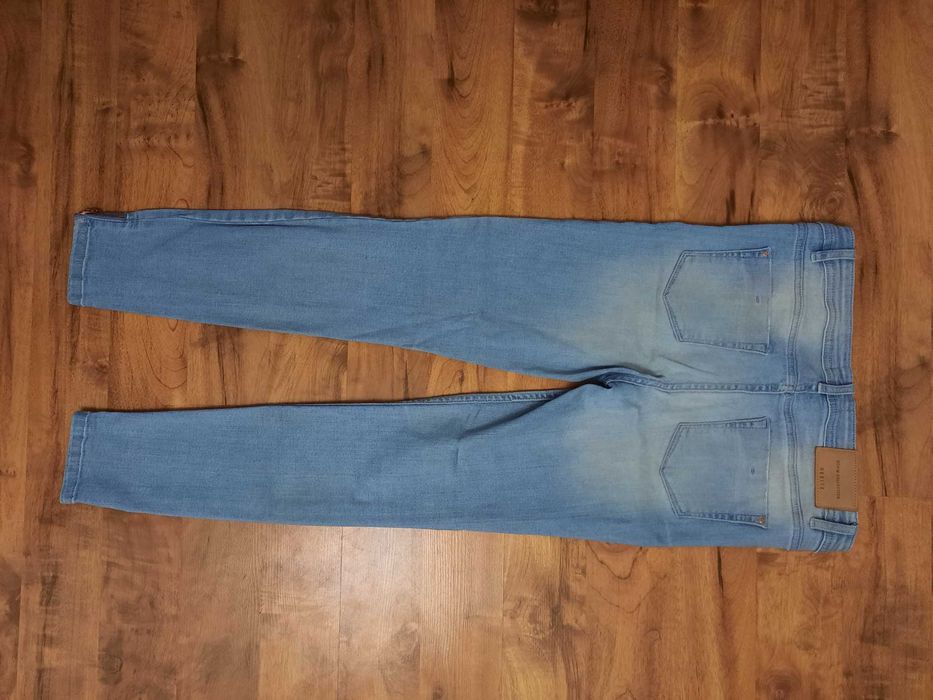 Jeansy z dziurami rozdarciami spodnie jeansowe Mohito rozmiar 36