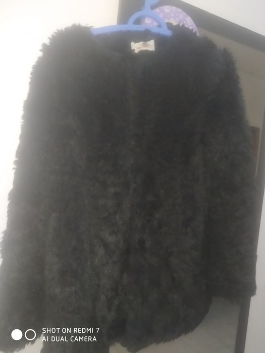 Casaco de pêlo preto