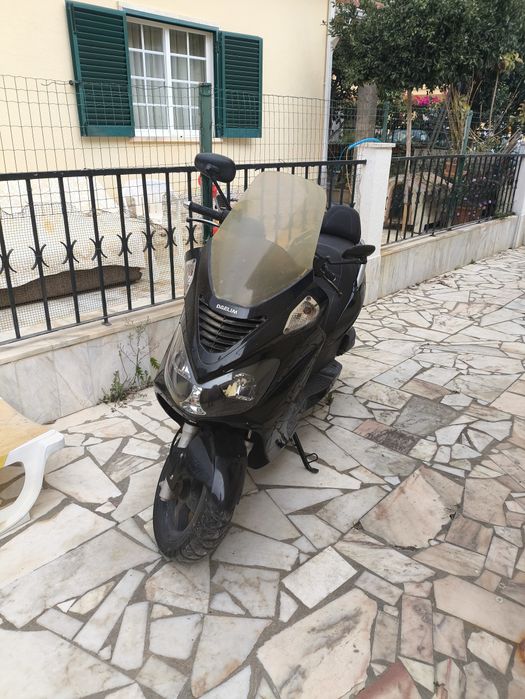 Mota Daelim S2 2010 para desocupar garagem
