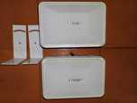 2 White Bose speakers .  complete with optional white wall brackets