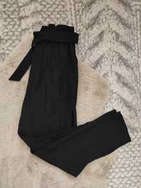 Czarne spodnie z wysokim stanem wiązane szerokie