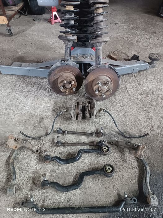 Стойки передні BMW E34 ричаги суппорт диски бмв е34 амортизатори цапфа