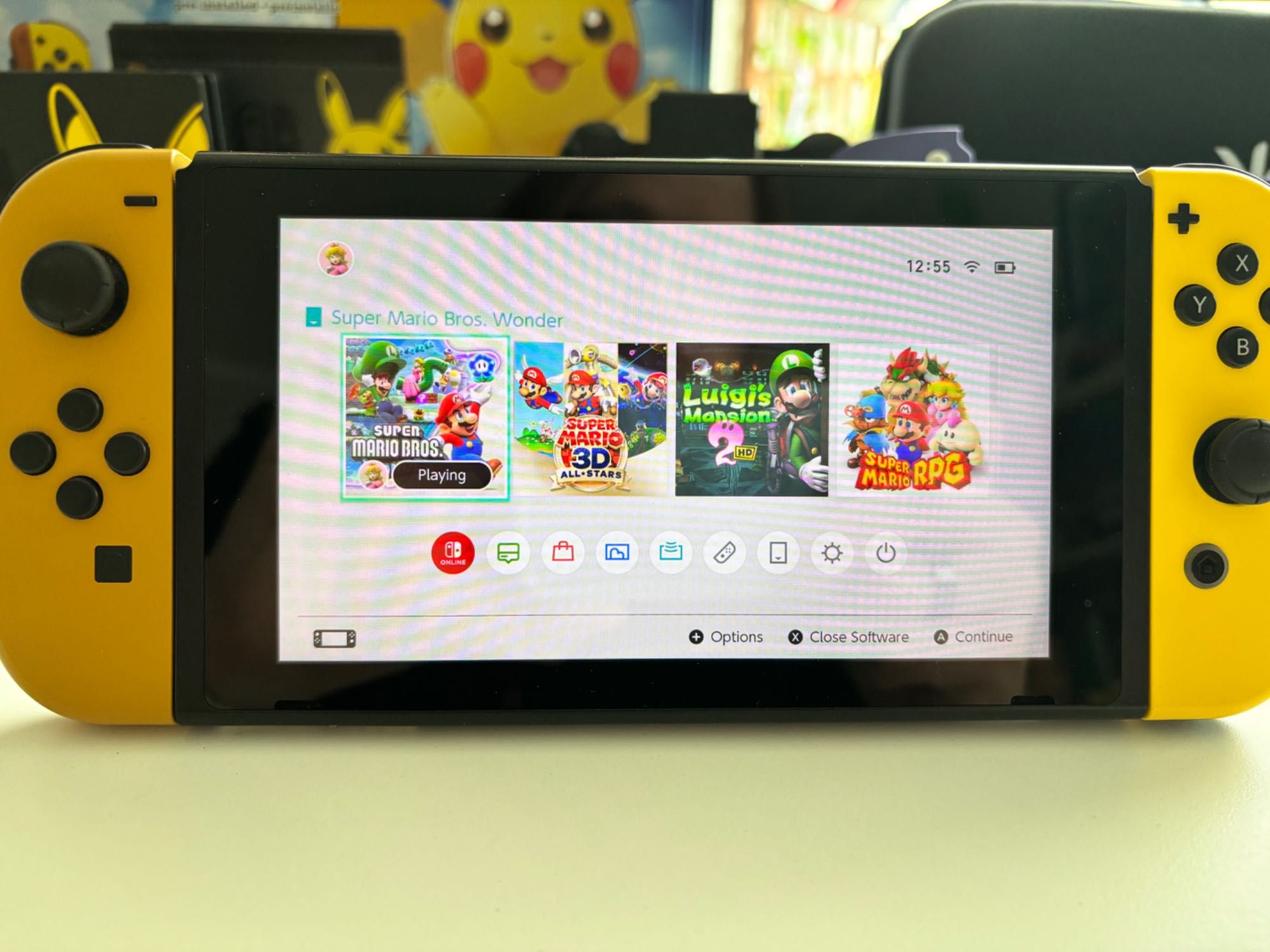 Nintendo Switch Let's Go Pikachu & Eevee Edition + Gry + Nitro Deck
