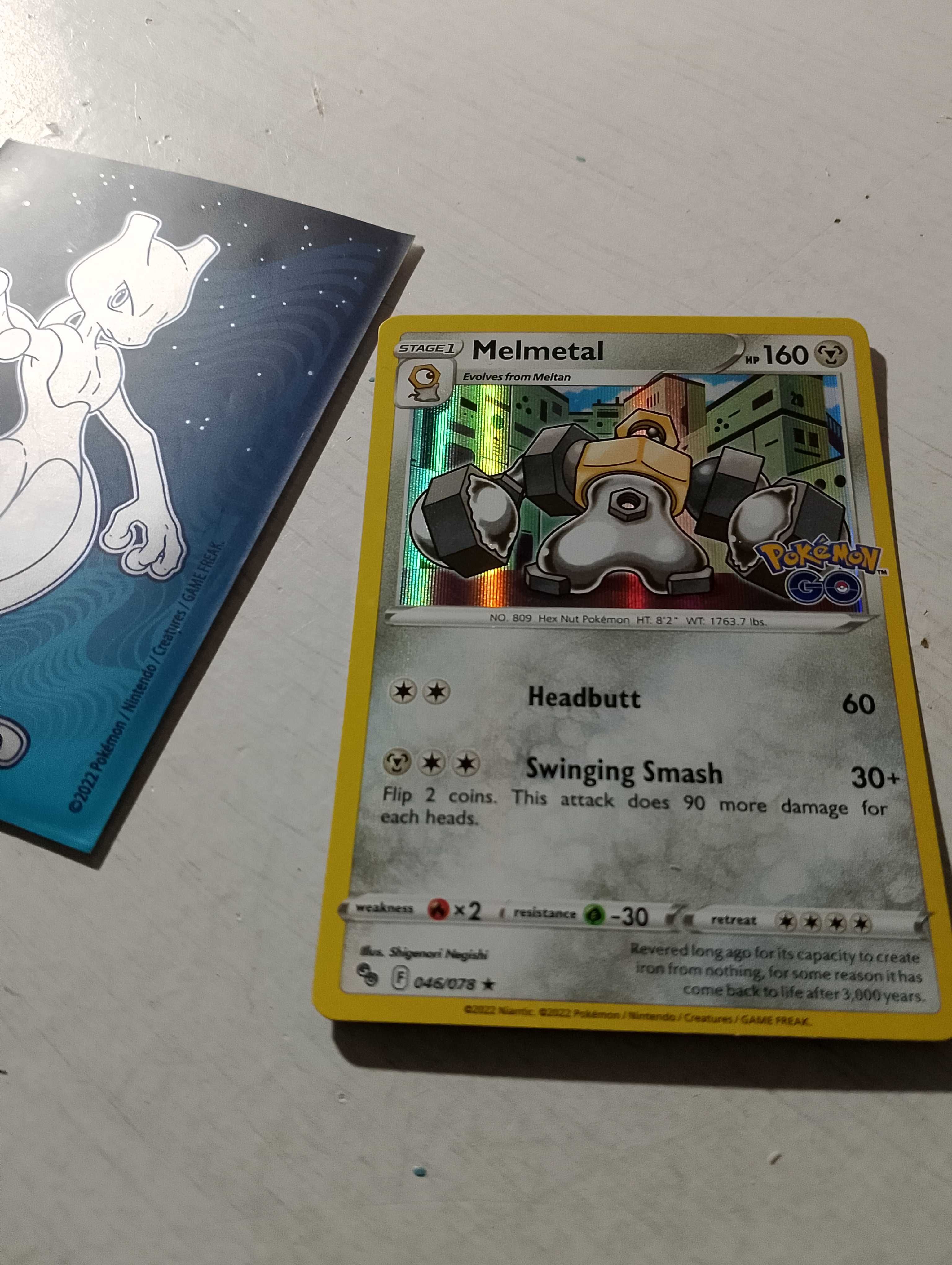 Karta pokemon go Melmetal plus folia Mewtwo