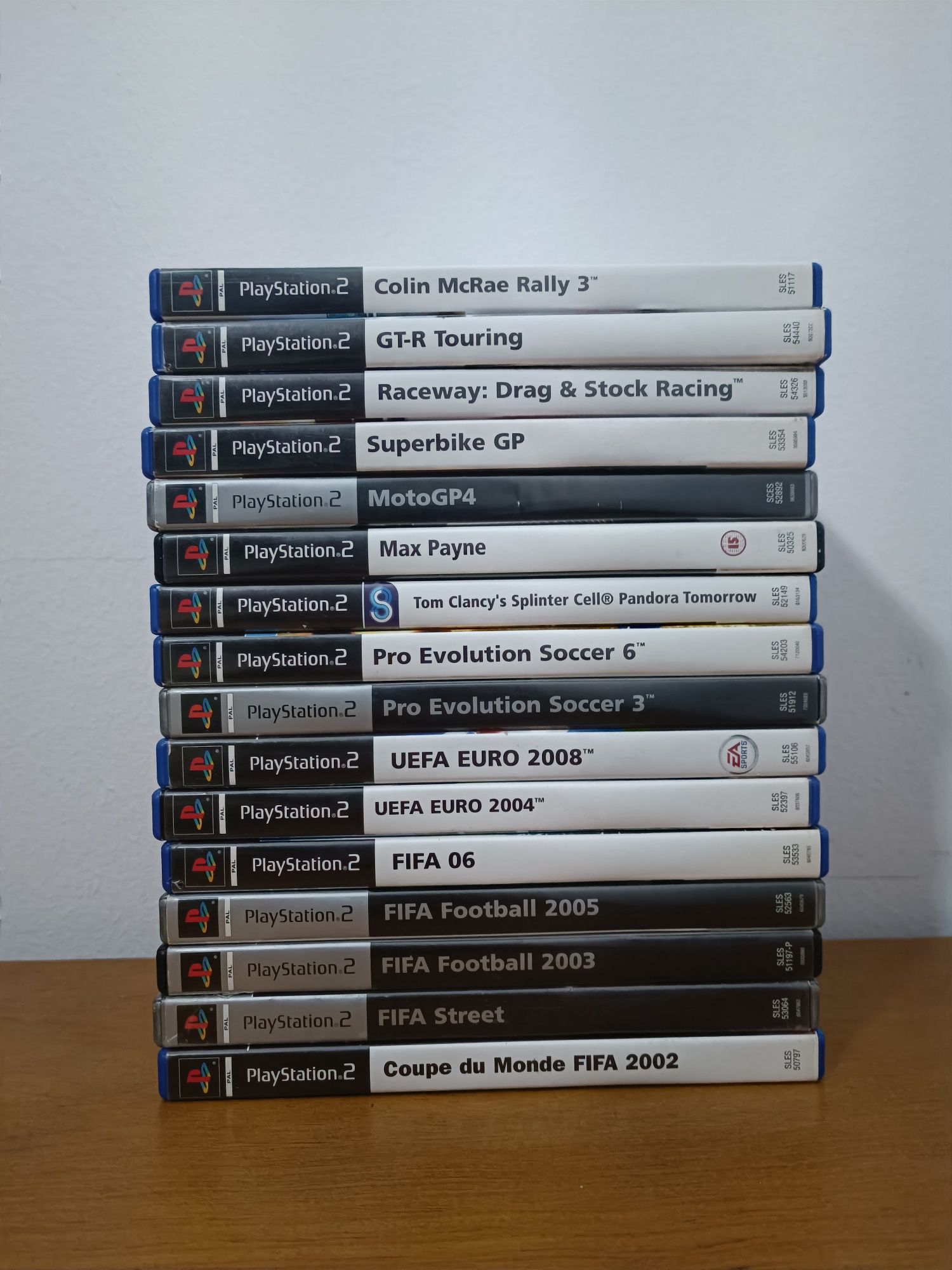 PlayStation 2 + 1 comando + cabo de vídeo +  16 jogos