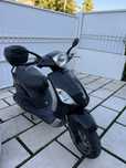 Piaggio Fly 125 com top case
