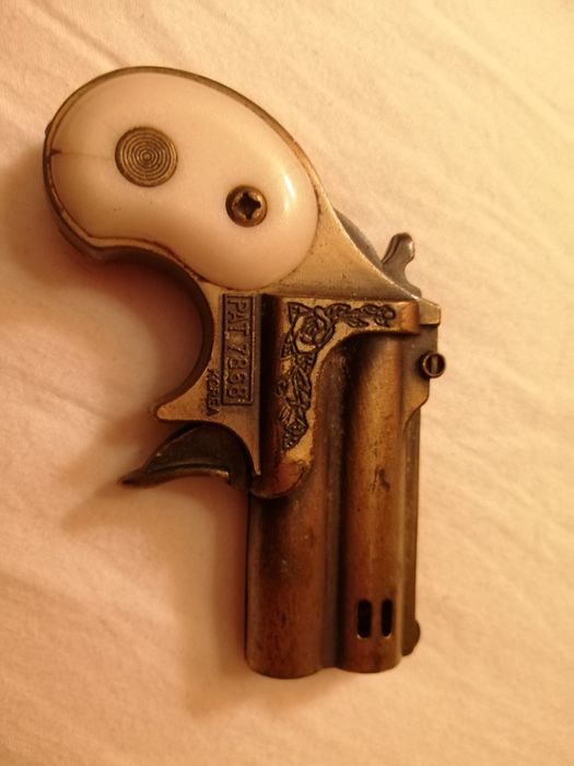 Isqueiro pistola antigo
