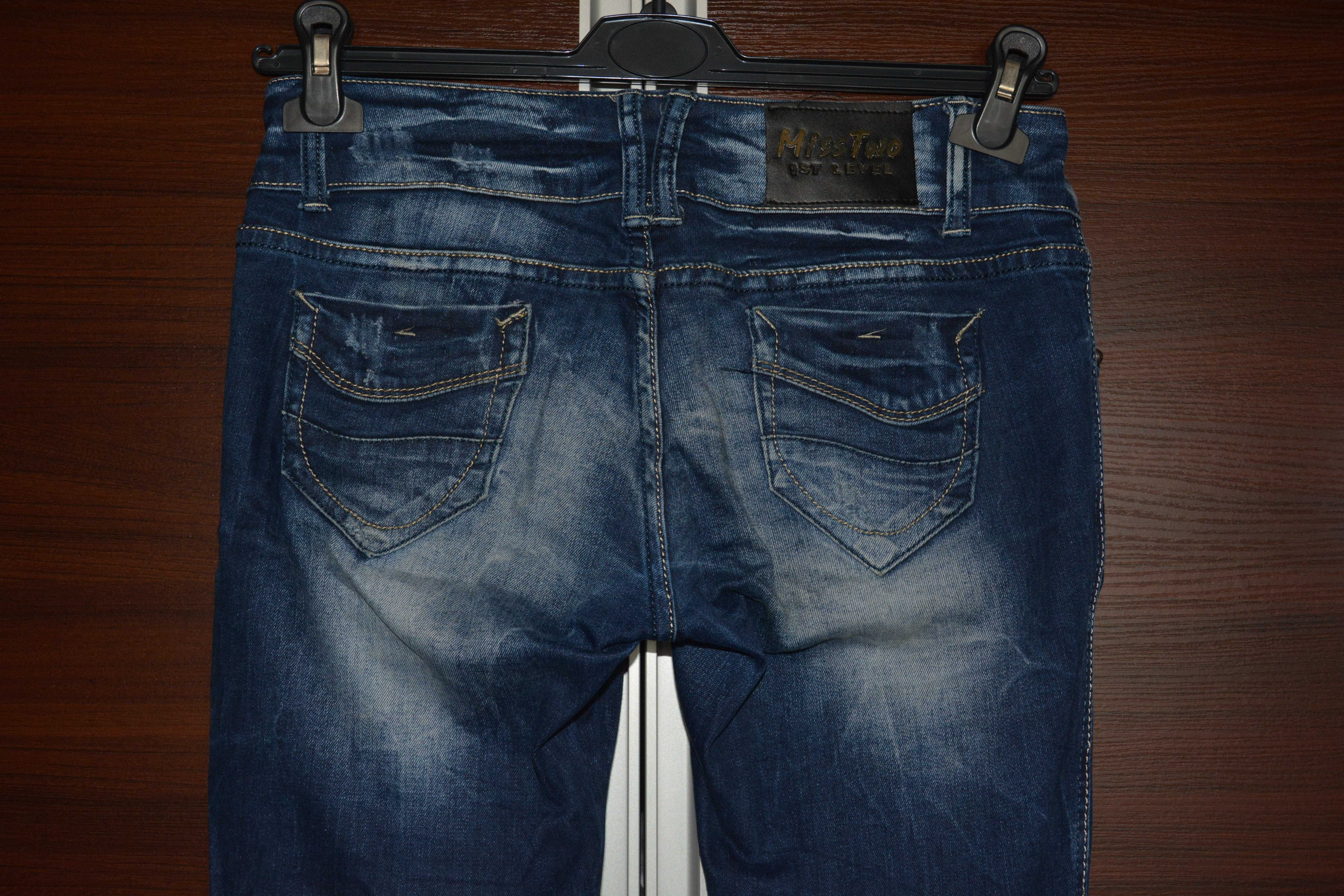 Nowe modne spodnie jeansy biodrówki skinny cieniowane z przetarciami