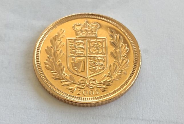 Moeda meia libra de ouro brasão ano 2002