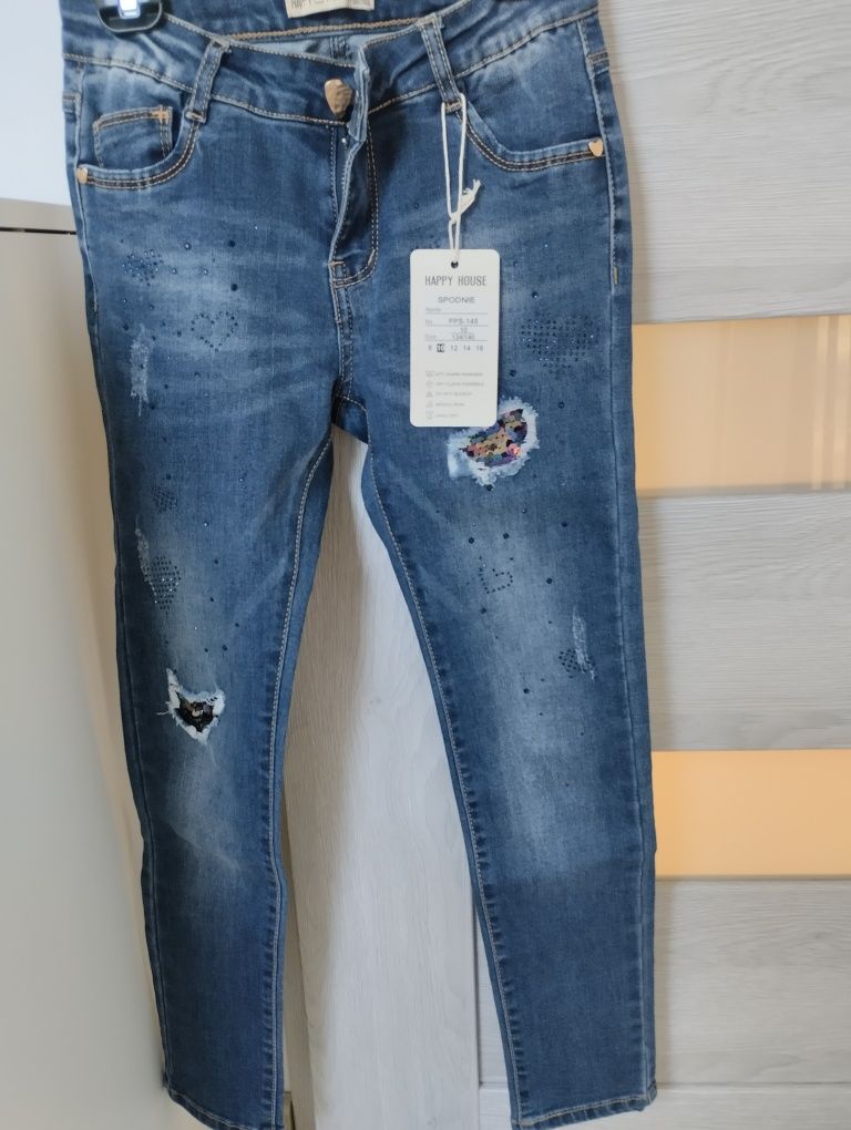 Nowe Spodnie jeansowe rozm 134/140