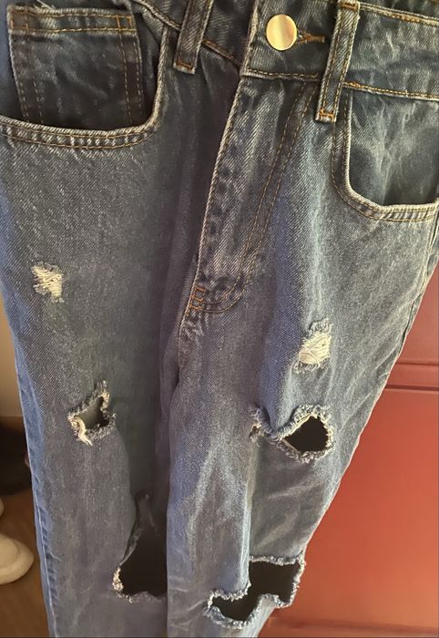 Calças de ganga rasgadas