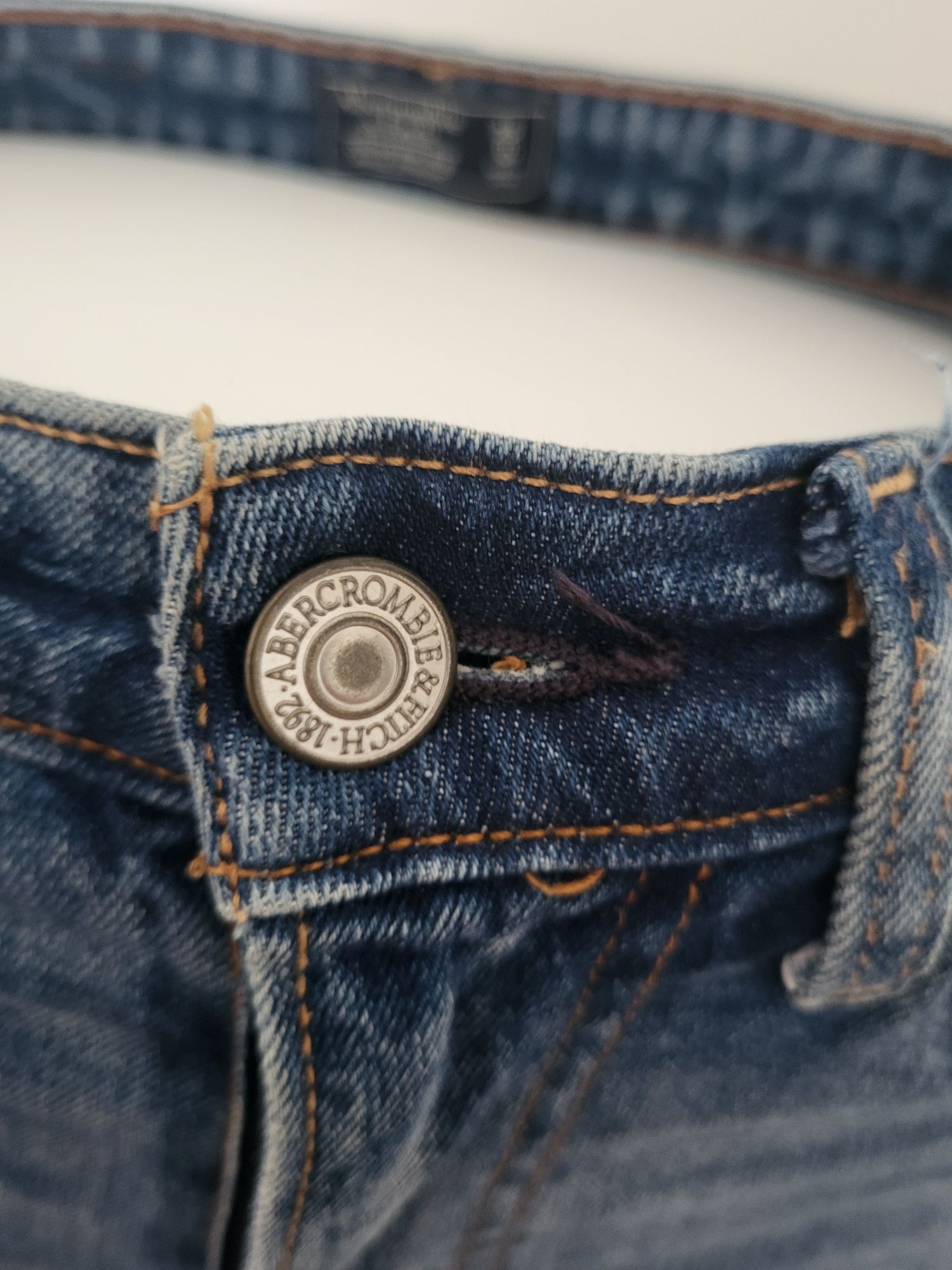 Ciemne niebieskie jeansy z wysokim stanem dziurami przetarciami 34 XS