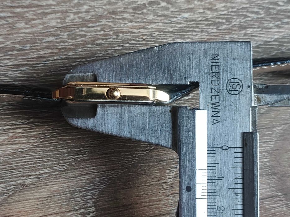 Sprzedam złocony męski zegarek garniturowy Deloitte & Touche