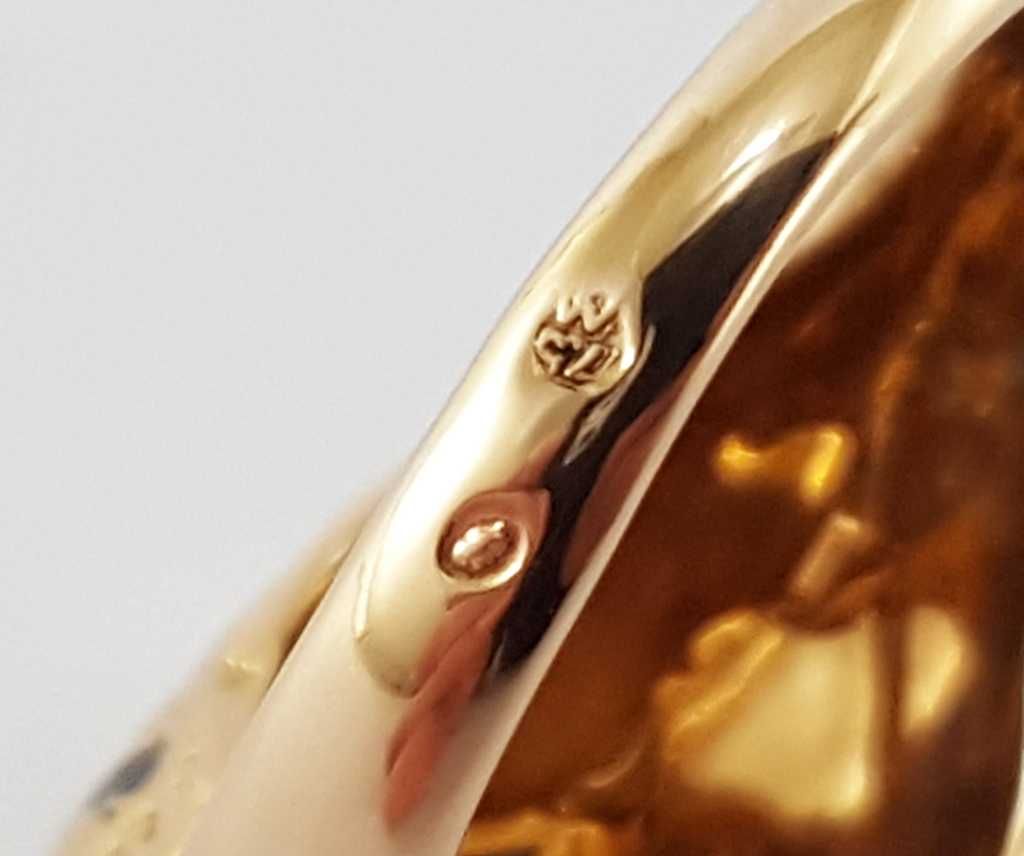 Złoty pierścionek w typie Cartier