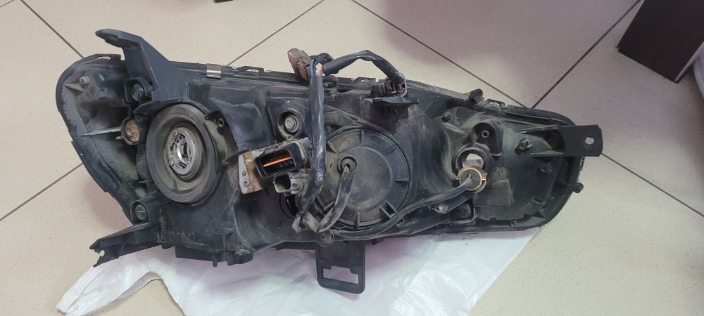 Фара передня ліва оригінал Lancer 2008 8301B259