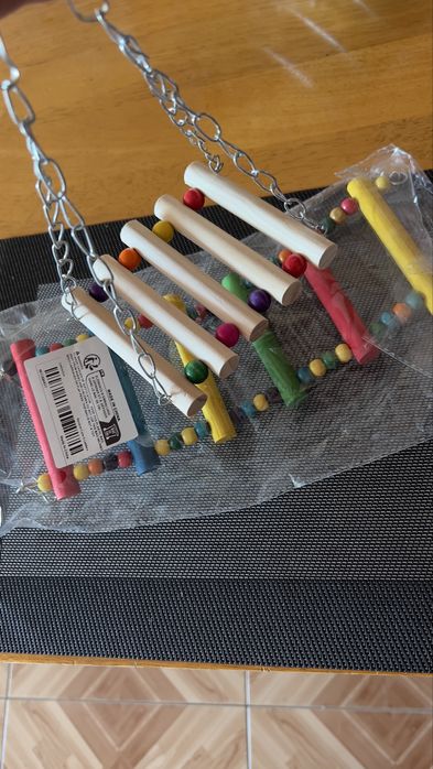 Качеля в клітку доя папуги