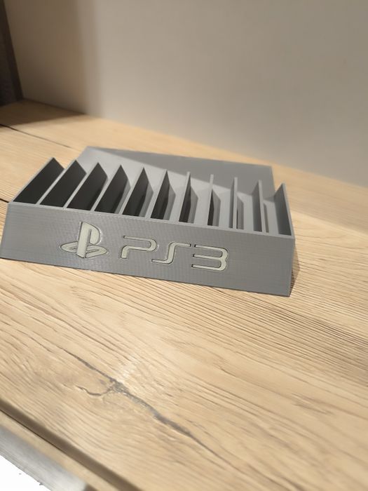 Stojak podstawka na gry PS3  napis fluorescencyjny