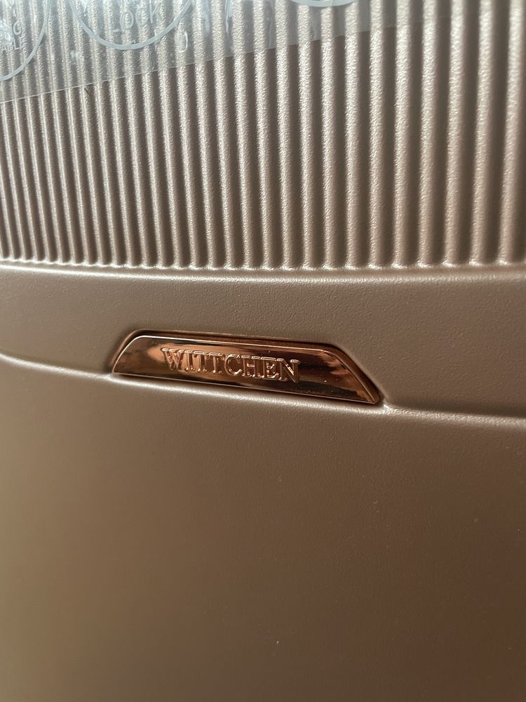 Duża walizka z polikarbonu Wittchen rose gold