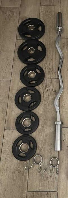 Barra olímpica em aço e pesos