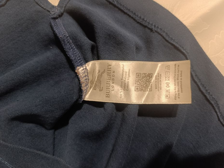 Koszulka Polo Burberry - unikalna wersja na zatrzaski.