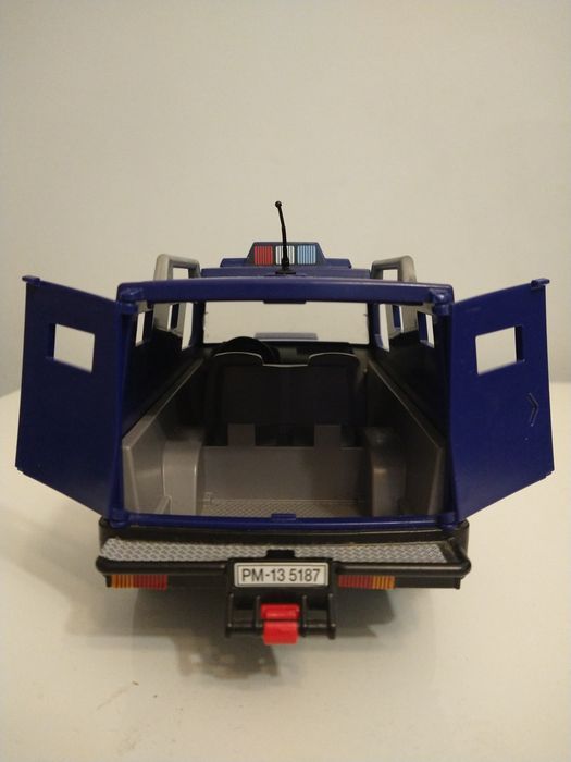 Playmobil radiowóz i łódka.