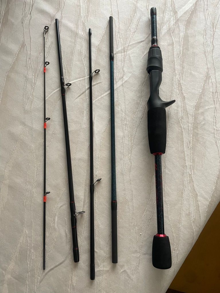 Carretilha e cana de pesca nova com cana de pesca nova