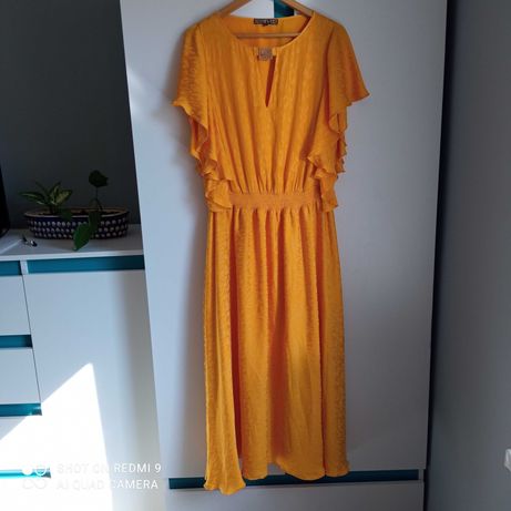 Urocza żółta sukienka biust 56 rozmiar 46