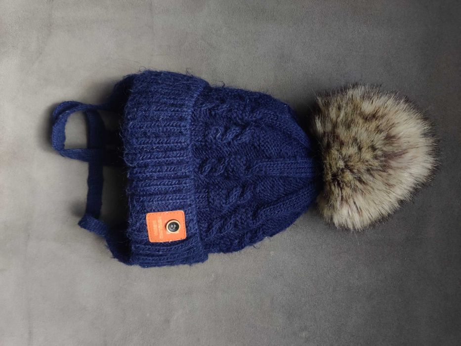 Зимова шапка 2 помпона мех беж рижа коричнева 48-50
Сіра