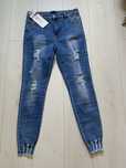 Wygodne jeansy spodnie damskie z dziurami 42/xl