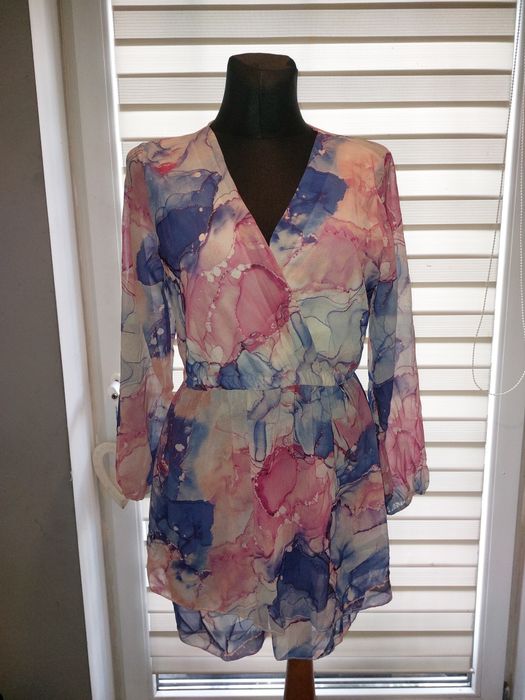 Nowy kombinezon damski kopertowy marmurkowy
Rozmiar S M