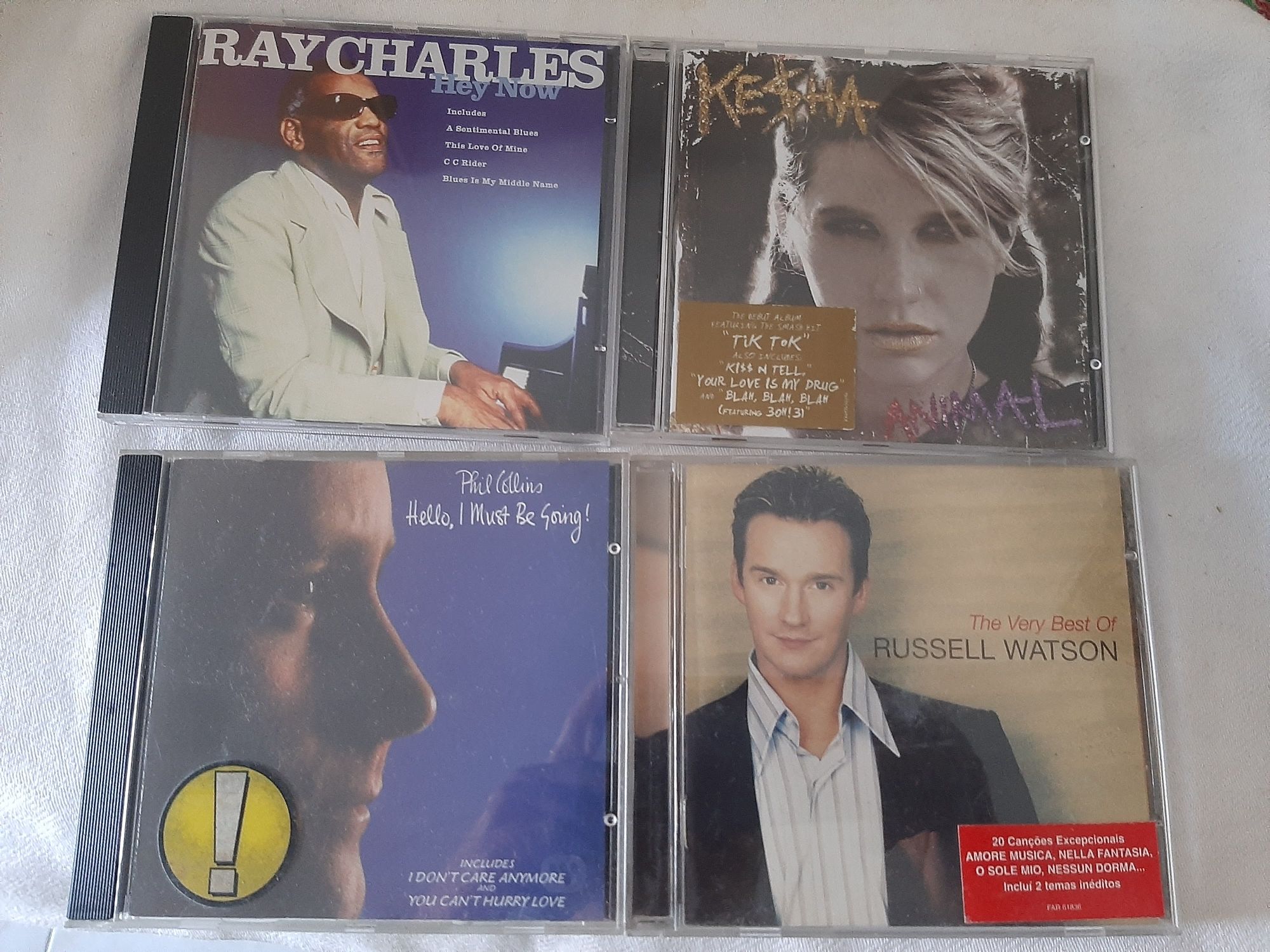 C. d. música originais como novos
