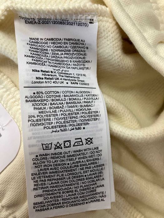 Waniliowe spodnie dresowe Nike roz.M