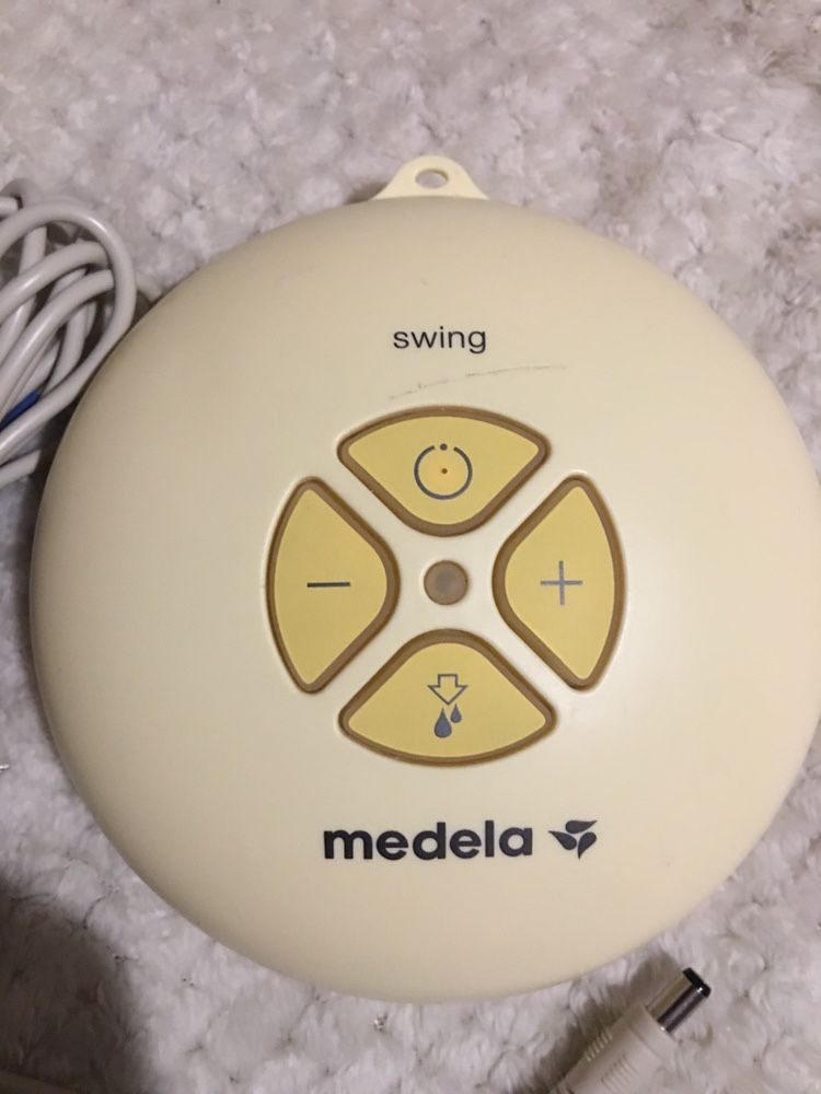 Молокоотсос medela swing