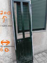 porta de  aluminio  verde sem vidros com fechadura