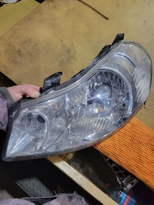 Фара Suziki SX4 2008 ліва оригінал