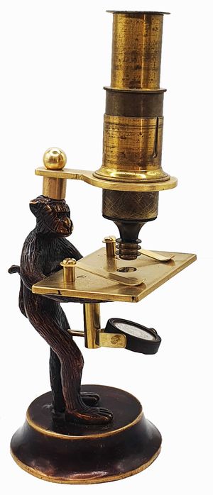 Brass reproduction of a “monkey microscope”